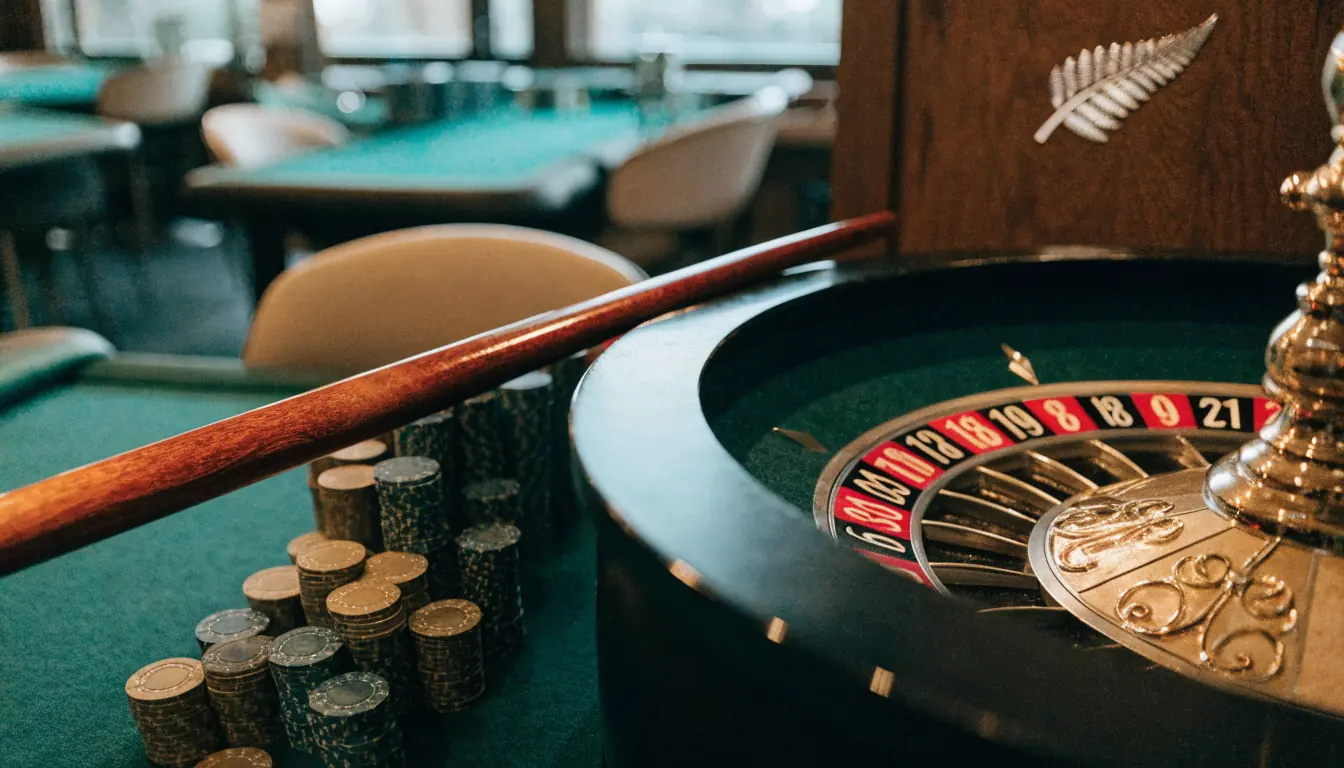 Roulette wheel with chips on a casino table, New Zealand themed setting